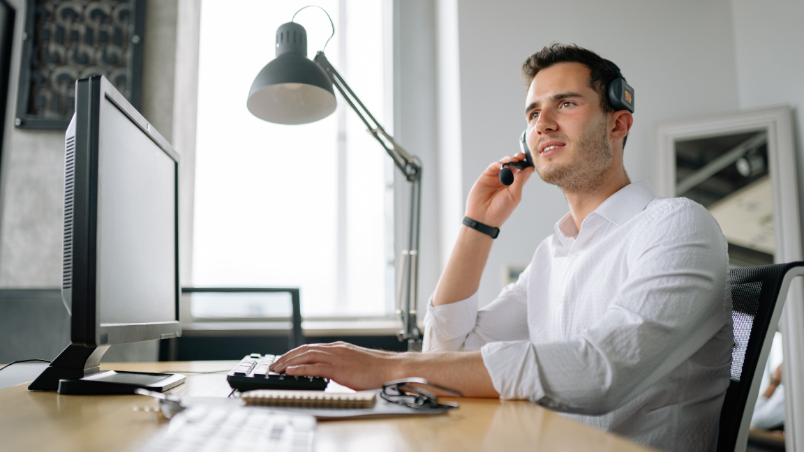 An employee on a call giving a customer support.