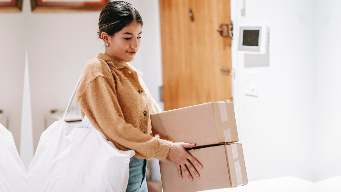 A woman moving boxes.